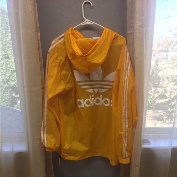 yellow adidas jacket with white stripes